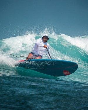Whopper Paddleboard: blue and red SUP with white logo for surfing
